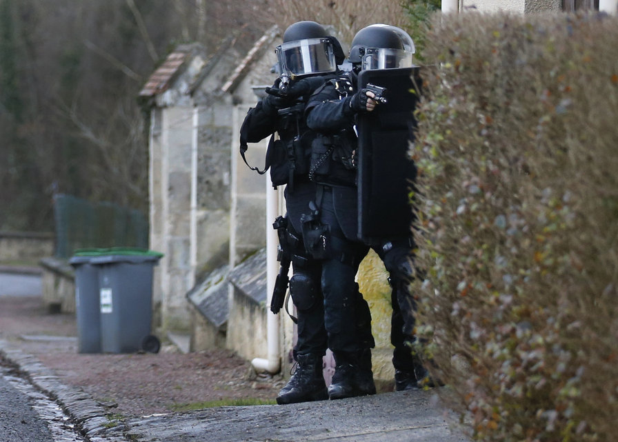 Members of the French GIPN intervention police forces secure a neighbourhood in Longpont, northeast of Paris